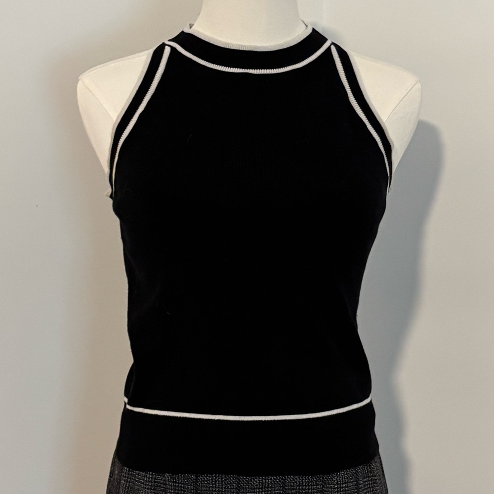 Elegant Black Sleeveless Top with White Accents